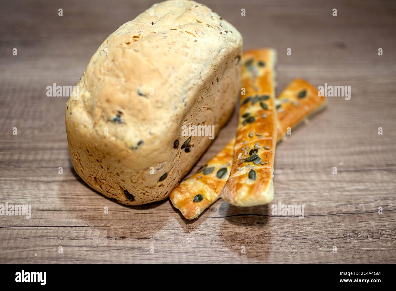 Molded home made bread and roll on table Stock Photo