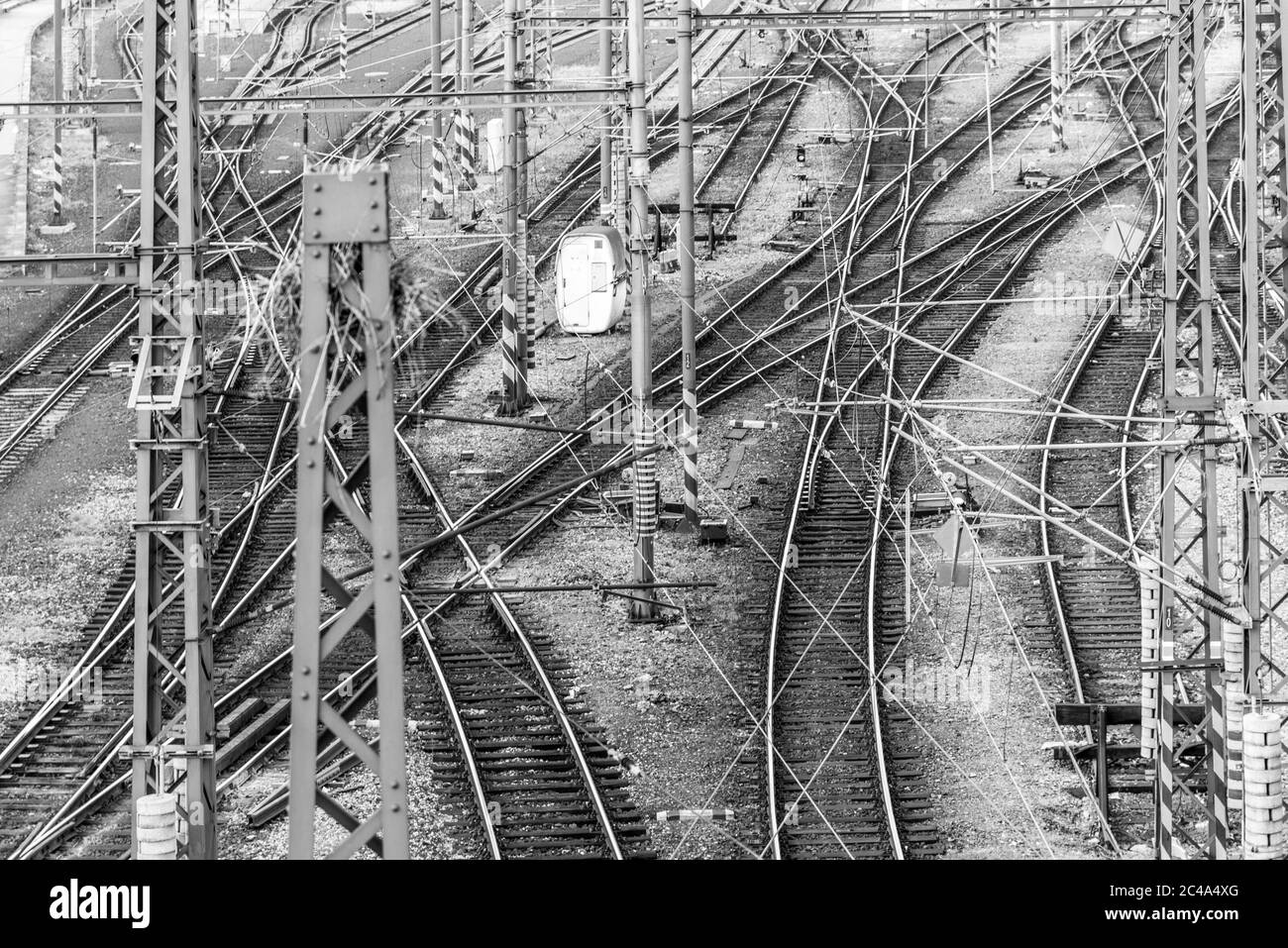 Railroad tangle at large train station. Railway transportation theme. Black and white image. Stock Photo
