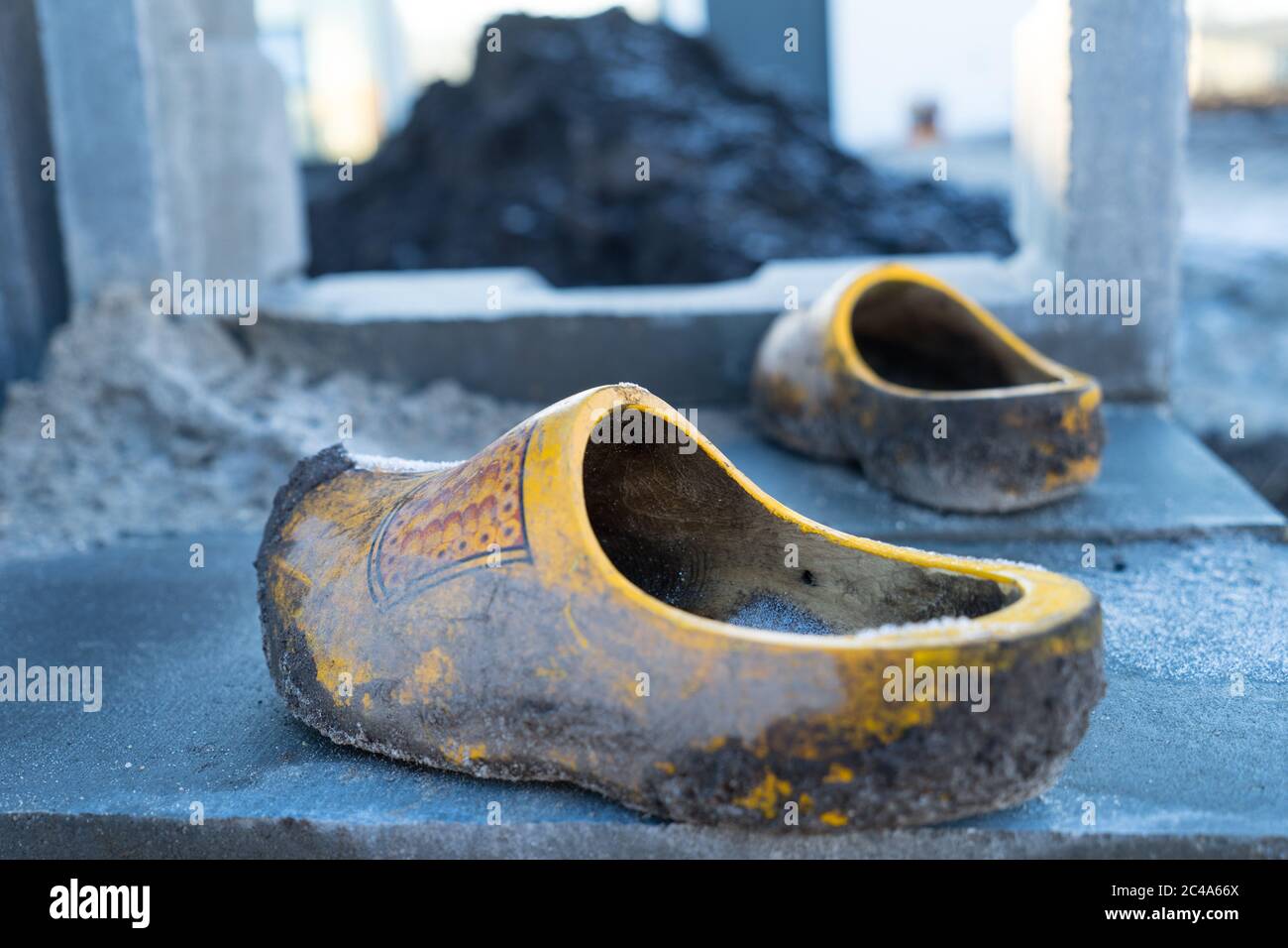 Traditional Dutch wooden shoes clogs used at a construction site with ...