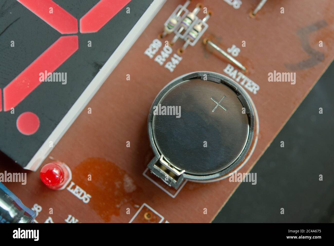 Lithium Battery Coin On Electronic circuit Stock Photo