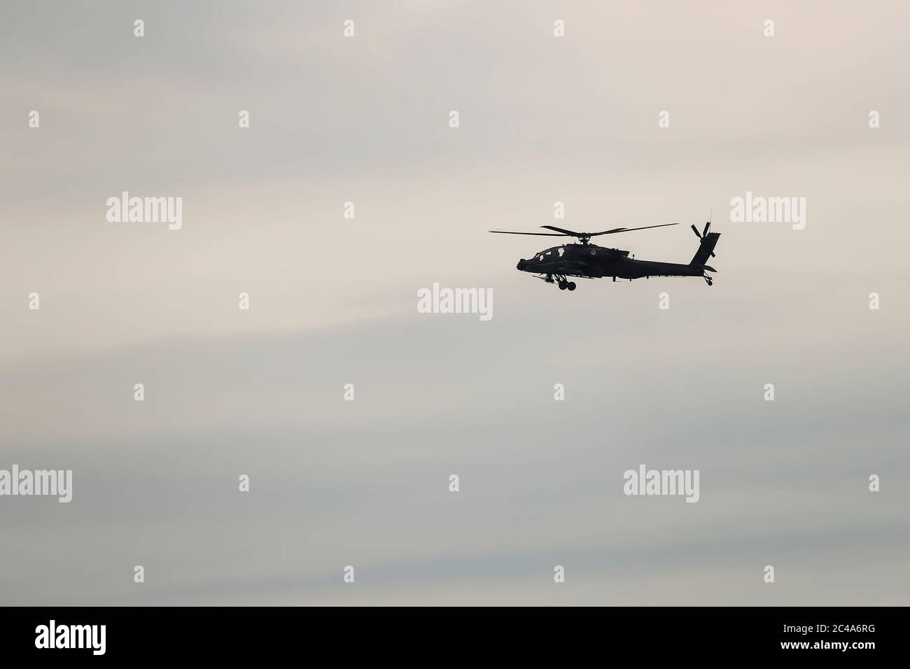 Askos, Greece - Feb 14, 2020: AH-64 Apache Helicopter takes part at a international military exercise with real fire (Golden Fleece -20) between Greek Stock Photo