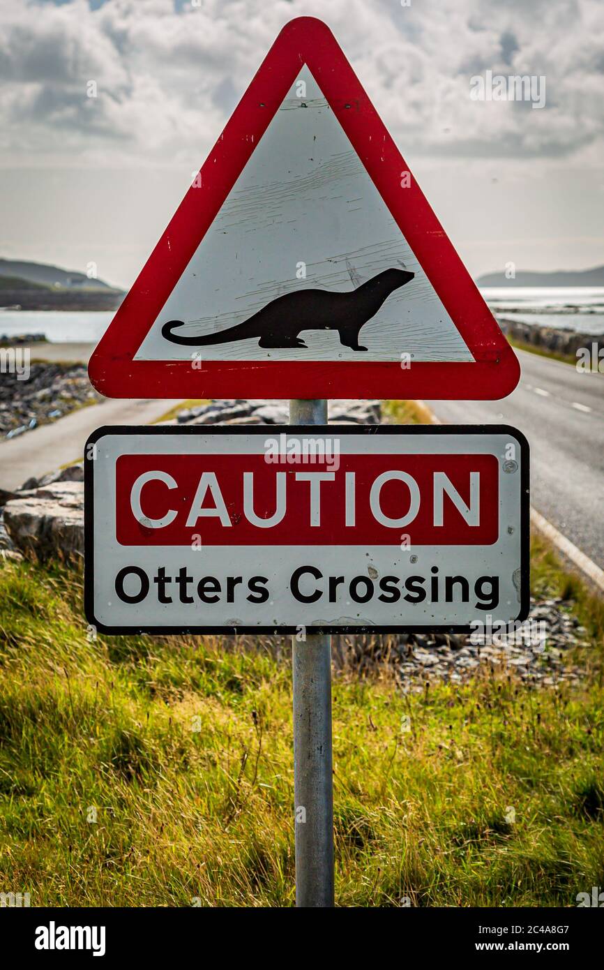 A sign warning of otters, on the causeway between South Uist and Eriskay in the Western Isles Stock Photo