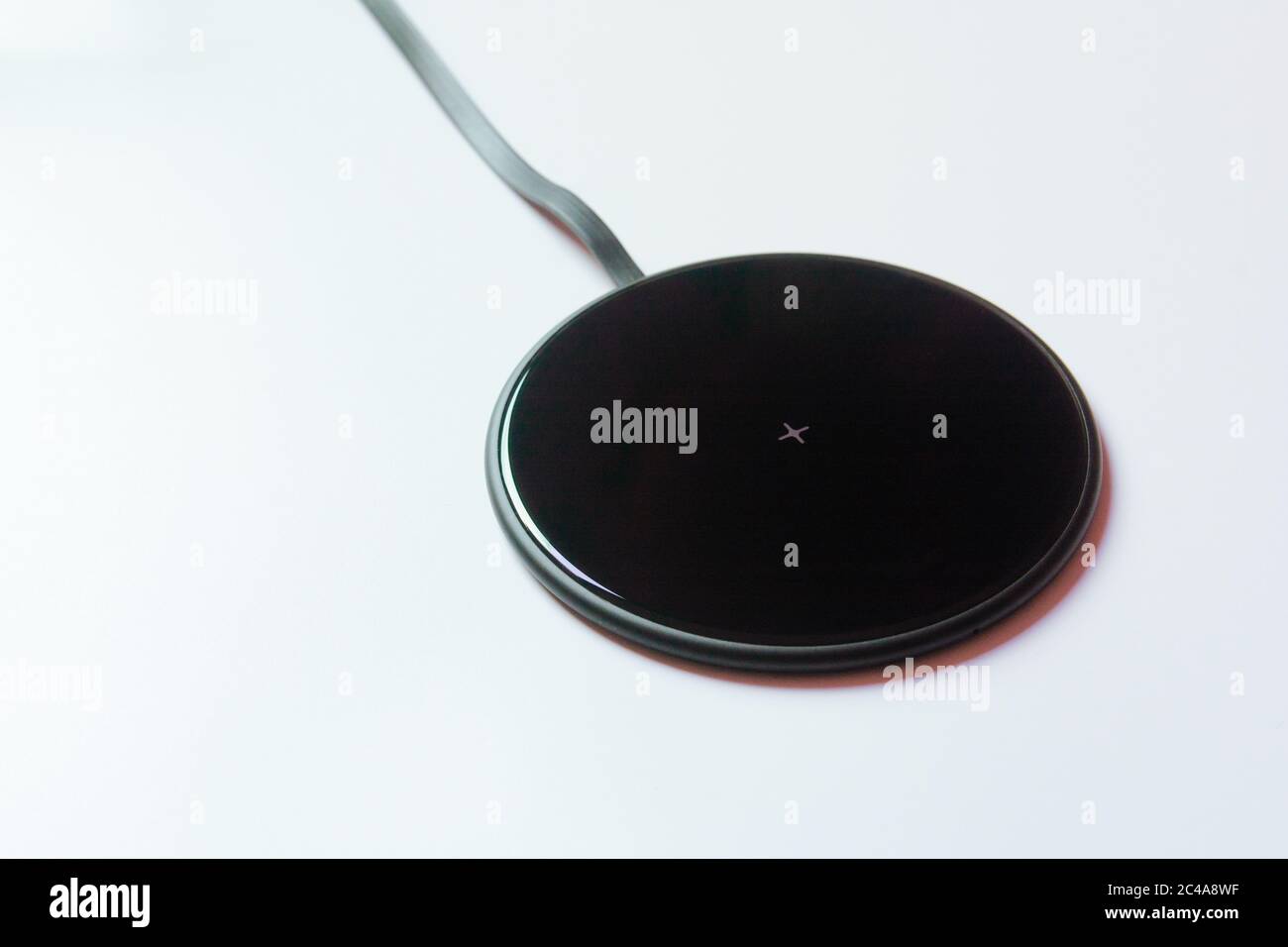 Wireless charger pad on withe background Stock Photo
