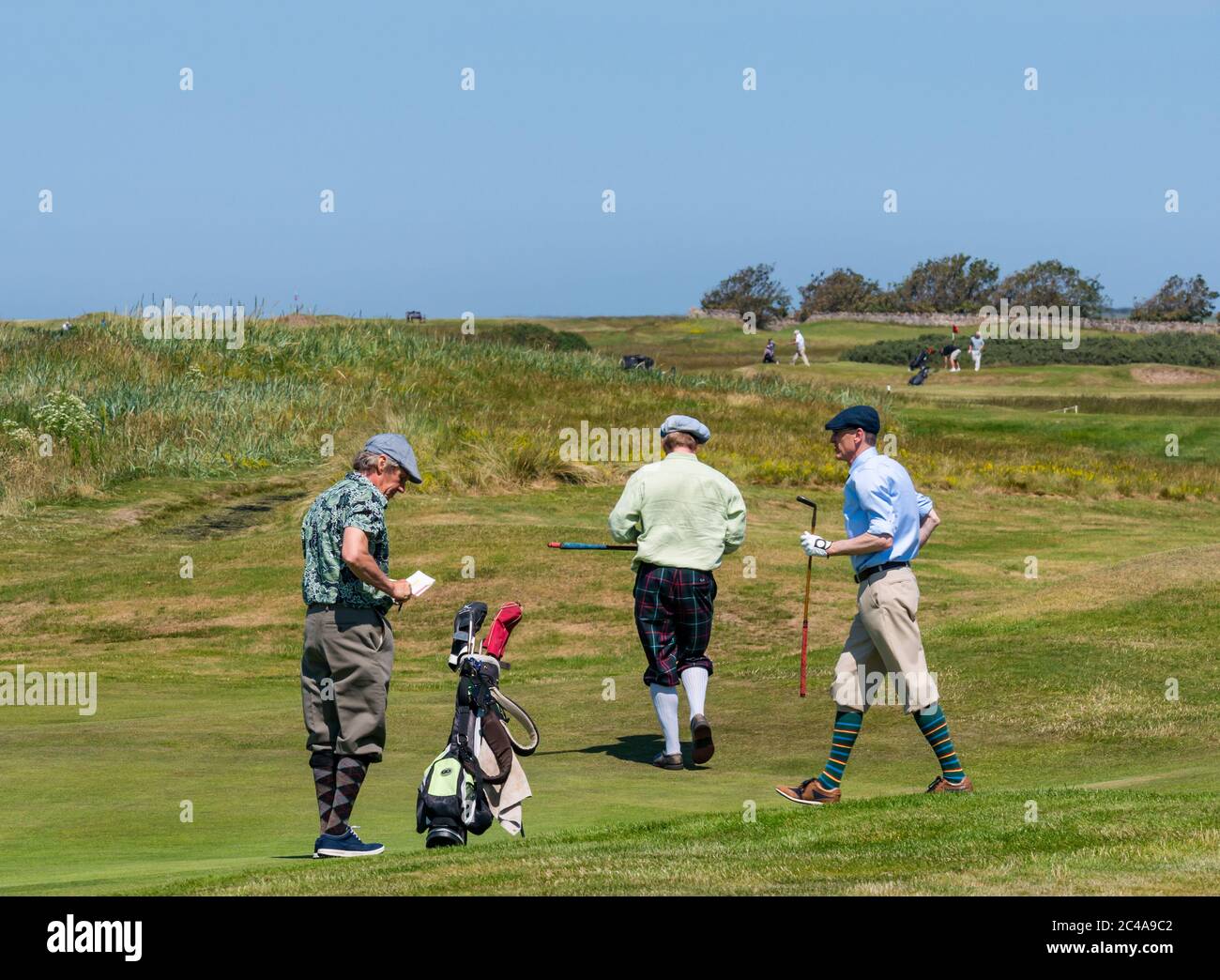 Aberlady, East Lothian, Scotland, United Kingdom, 25th June 2020. UK Weather: hot sunshine in Craigielaw golf course brings out men dressed in plus fours to play a round of golf Stock Photo