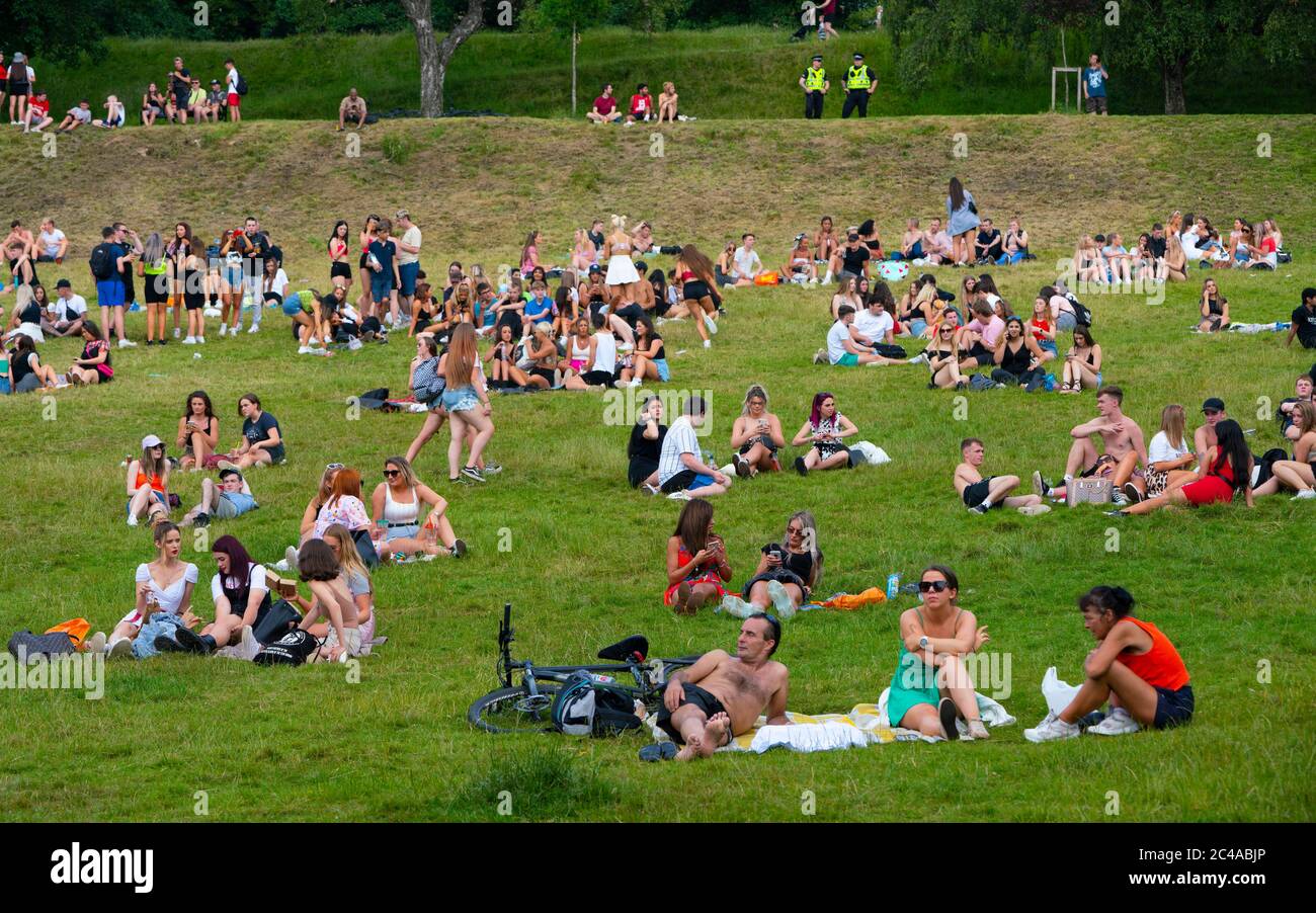 Glasgow, Scotland, UK. 25 June, 2020. Crowds of young people descended on Kelvingrove Park in the city’s west end to enjoy the sunshine and hot temperatures of up to 28C.  Iain Masterton/Alamy Live News Stock Photo