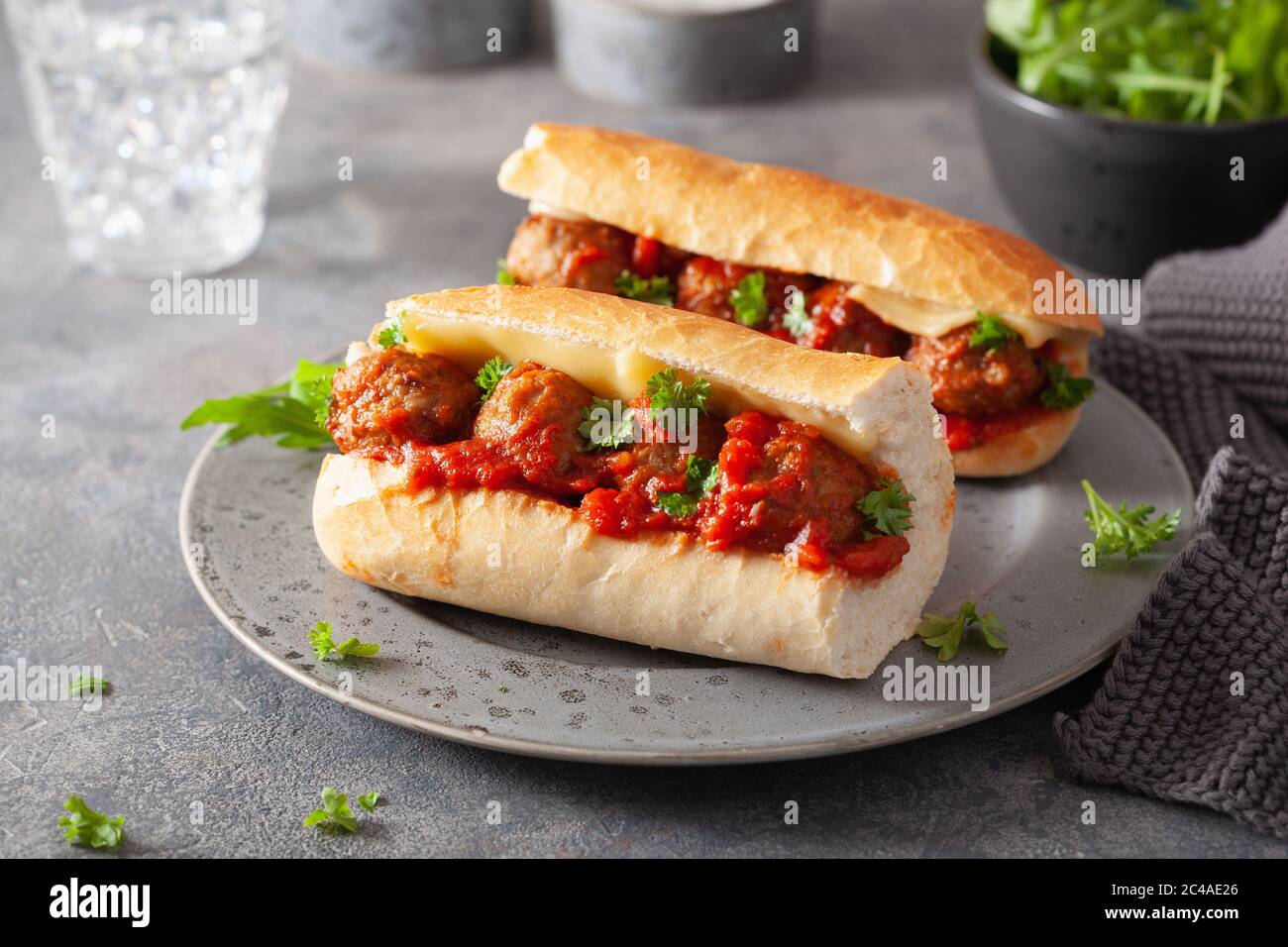 meatball sub sandwich with cheese and marinara tomato sauce. american
