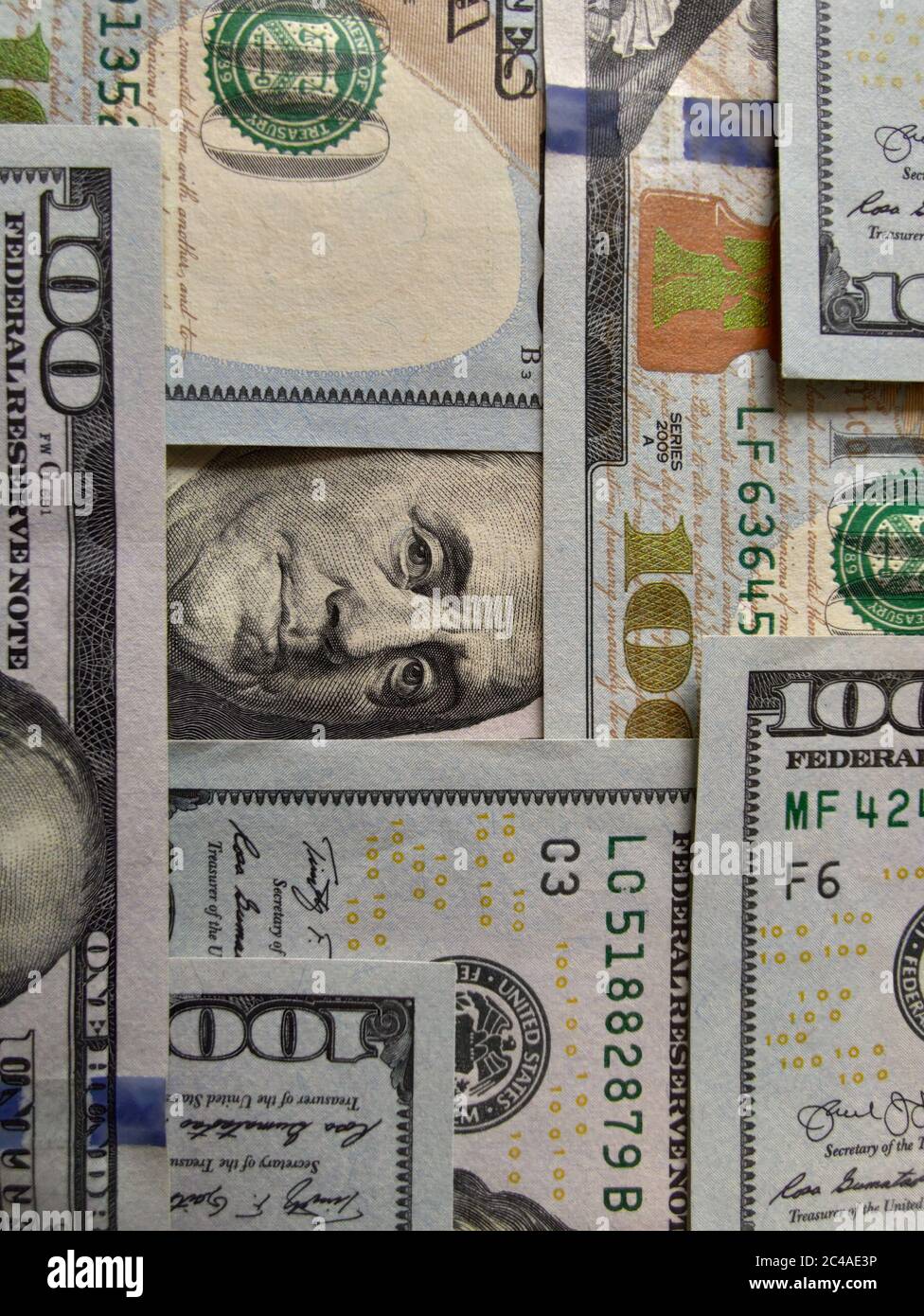 Closeup of of banknotes hundred dollar bills. Background of 100 dollar bills. One hundred dollars. Benjamin Franklin. Stock Photo