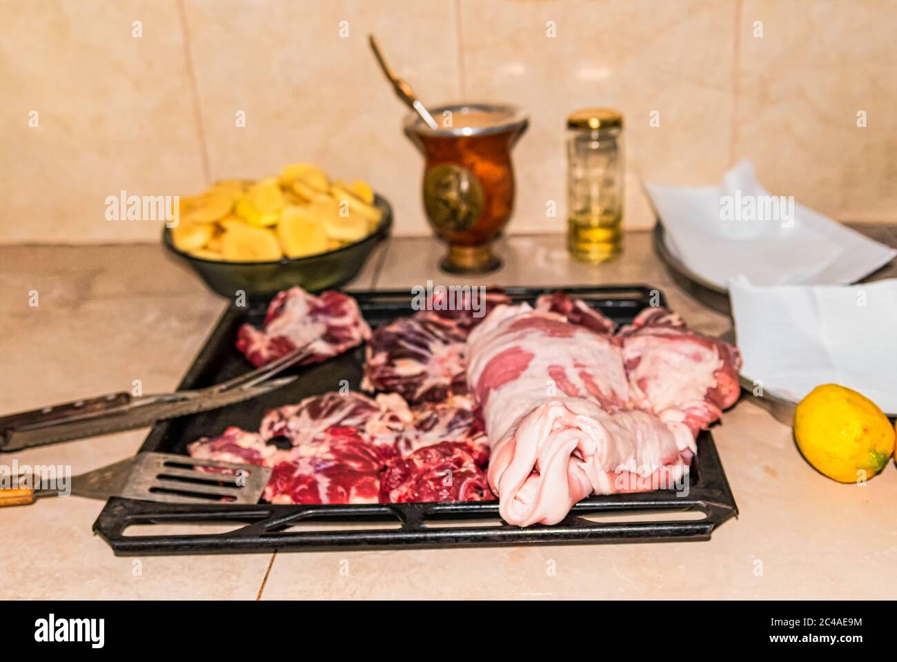 Different types of raw meat on the tables. On the rustic background. Stock Photo