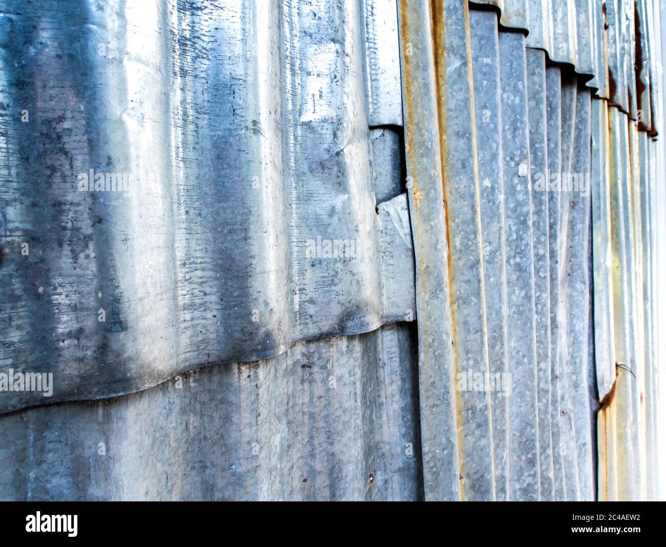 Rusty corrugated galvanized sheet iron fence Stock Photo