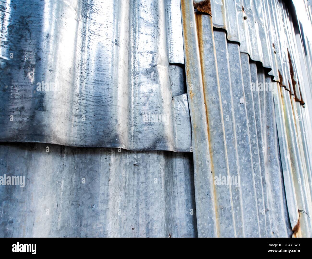 Rusty corrugated galvanized sheet iron fence Stock Photo