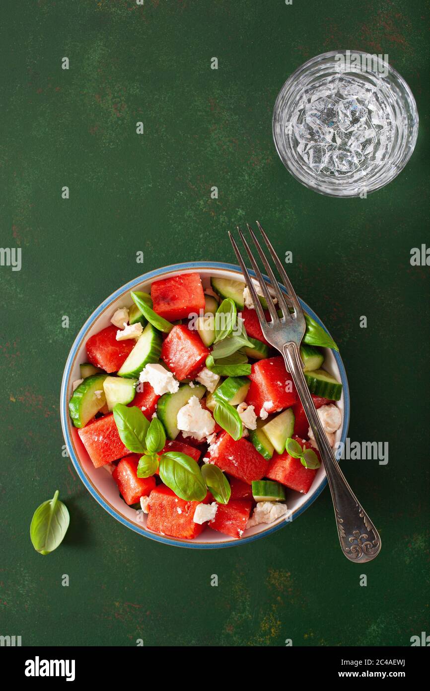 watermelon salad with feta cheese, cucumber and basil. healthy summer dessert Stock Photo