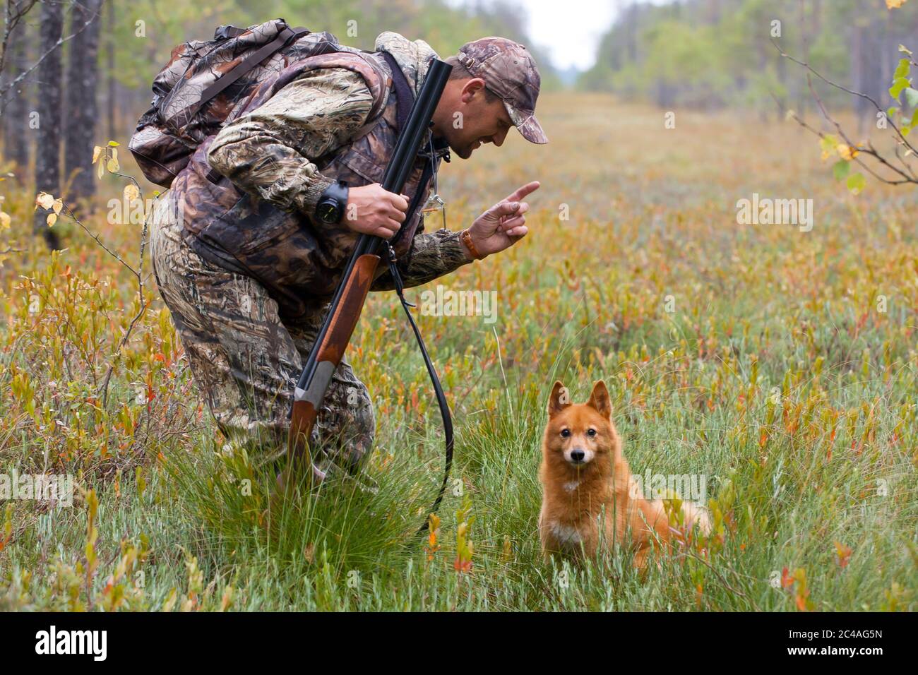 conversation between hunter and dog Stock Photo