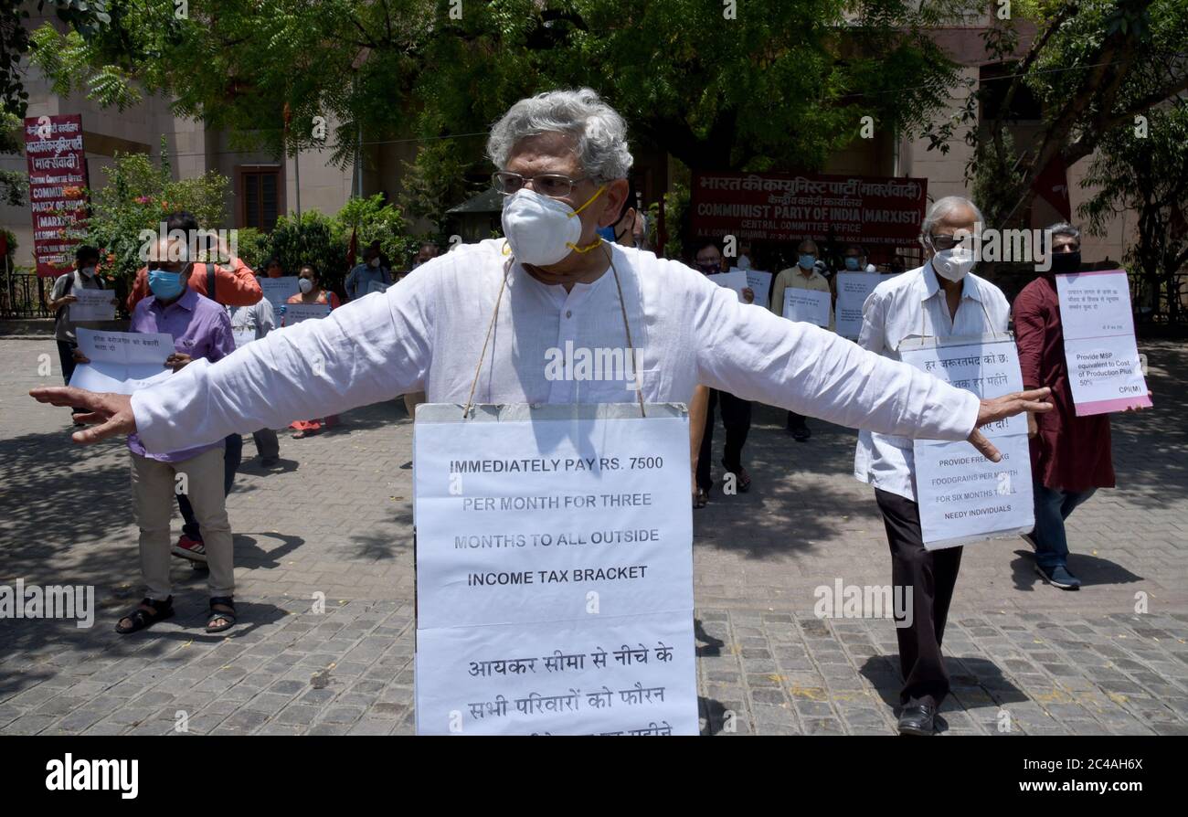Sitaram Yetchuri, General Secretary of Communist Party of India – Marxist (CPI-M) carrying a placard with demand for employment during a protest outsi Stock Photo