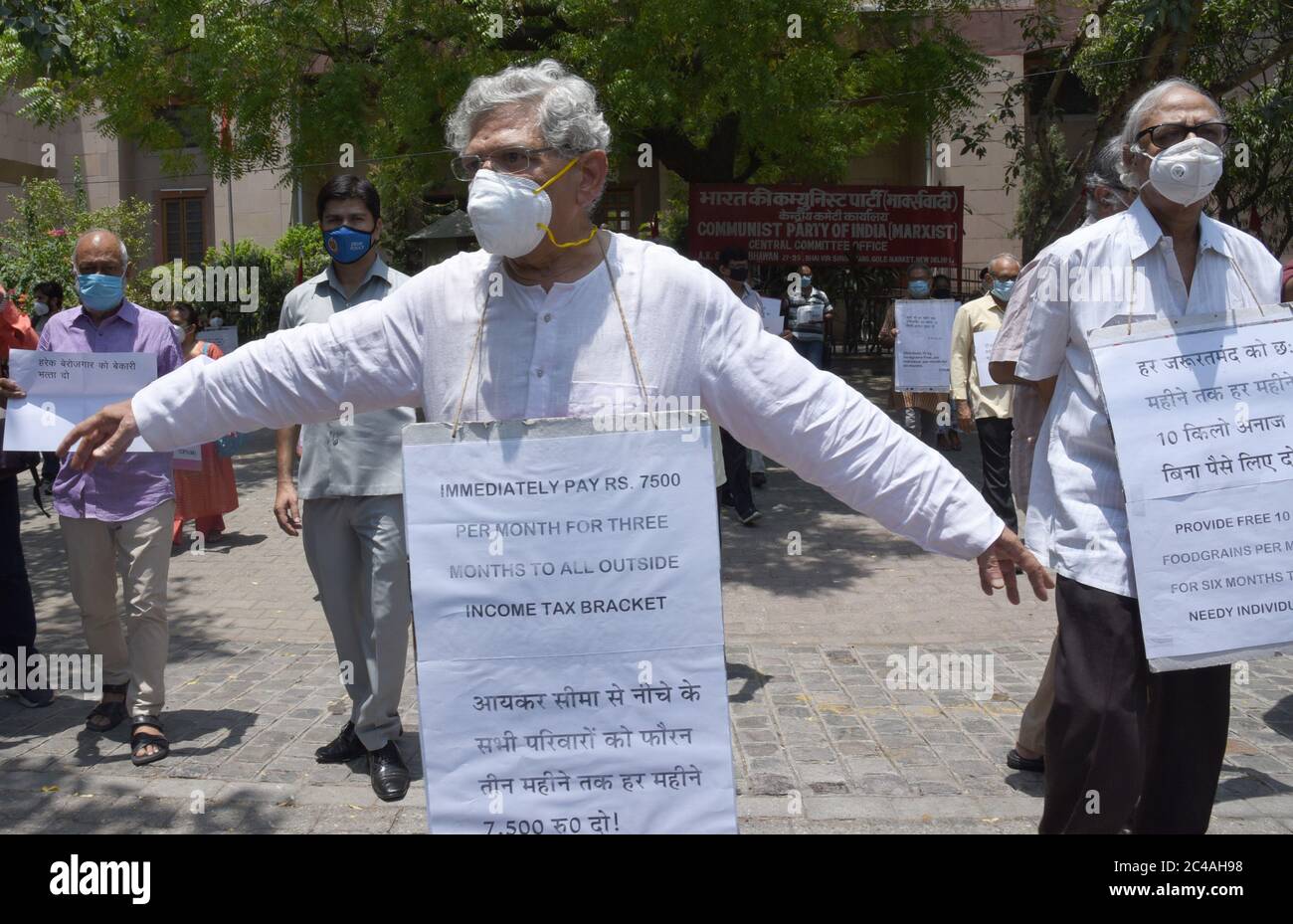 Sitaram Yetchuri, General Secretary of Communist Party of India – Marxist (CPI-M) carrying a placard with demand for employment during a protest outsi Stock Photo