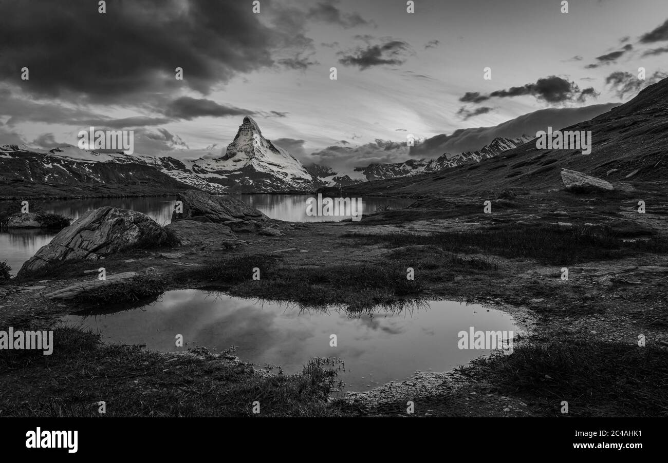 Matterhorn reflected in a small pool next to Stellisee at sunset, Zermatt, Valais, Switzerland Stock Photo