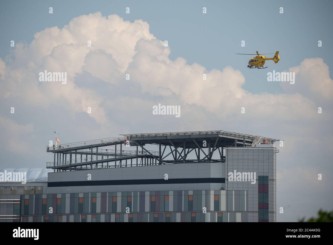 Glasgow, Scotland, UK. 25th June, 2020. Picture: Queen Elizabeth University Hospital (QEUH) helipad which is situated on the south west of the main building. Seen is the Scottish Air Ambulance Service transferring a patient. Credit: Colin Fisher/Alamy Live News Stock Photo