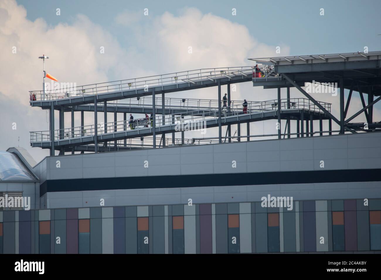 Glasgow, Scotland, UK. 25th June, 2020. Picture: Queen Elizabeth University Hospital (QEUH) helipad which is situated on the south west of the main building. Seen is the Scottish Air Ambulance Service transferring a patient. Credit: Colin Fisher/Alamy Live News Stock Photo