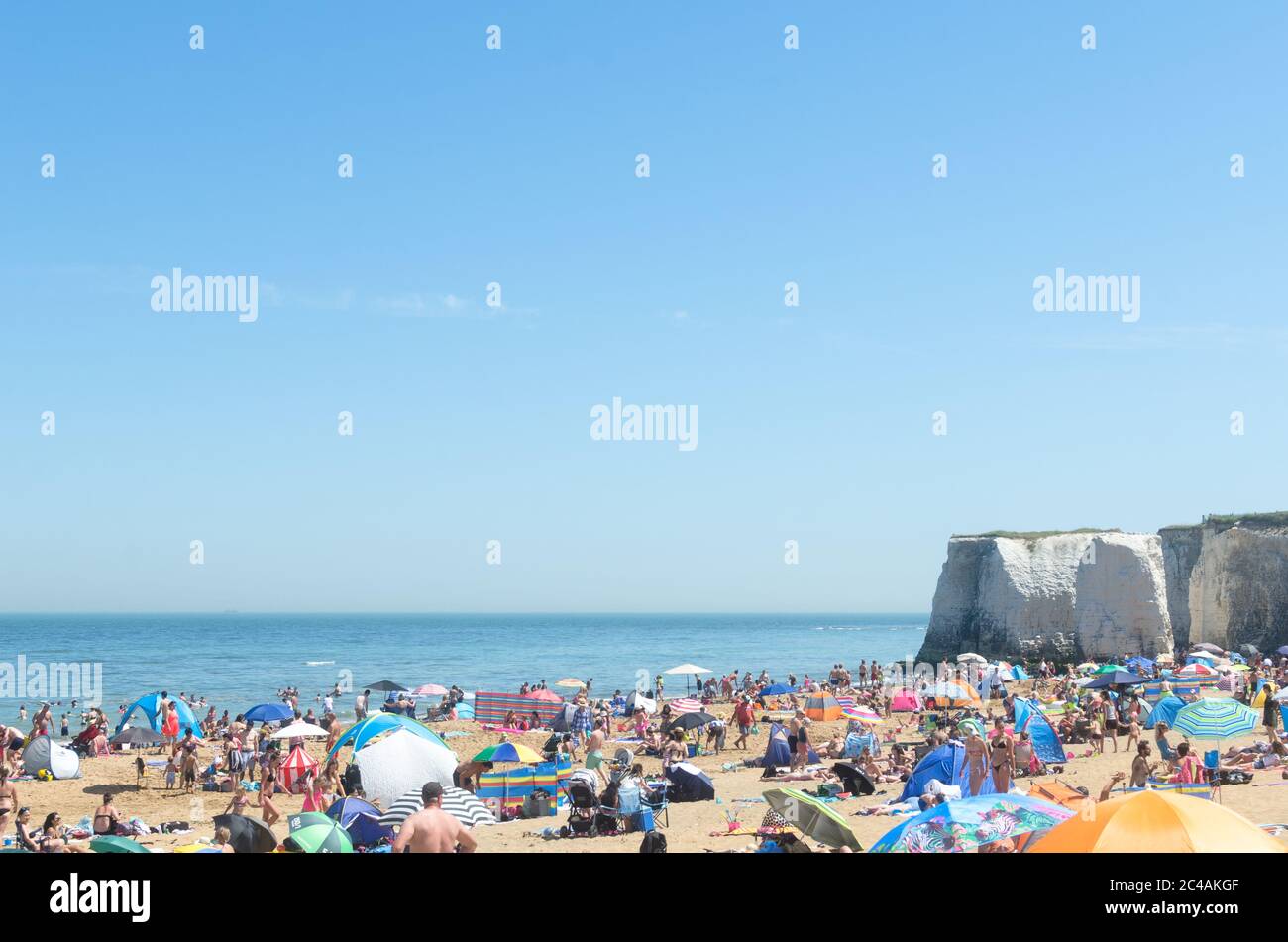 Broadstairs, Kent, England  - Despite lockdown restrictions due to the Coronavirus, crowds gather on the sandy beach on the hottest day of the year Stock Photo