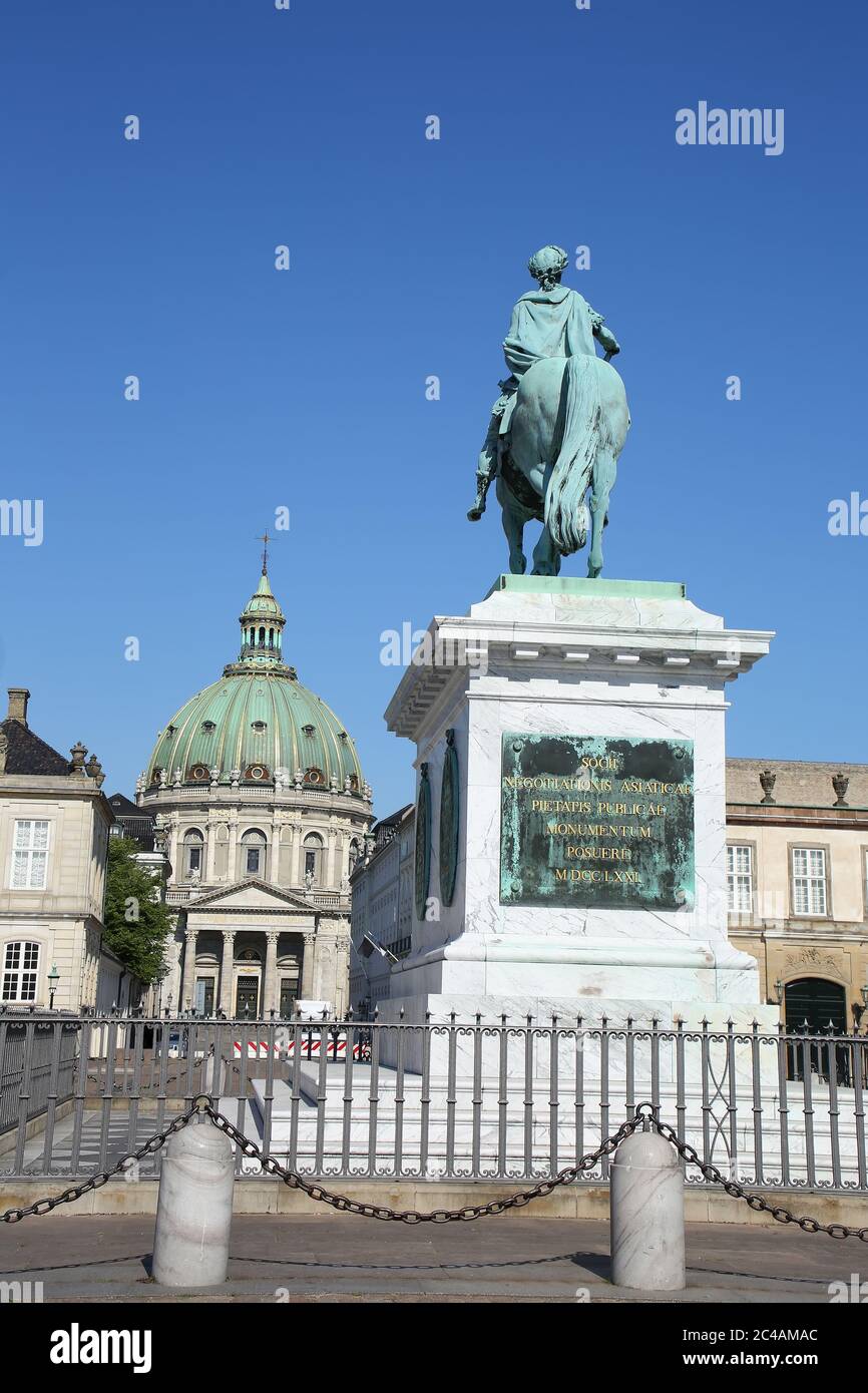 Amalienborg Palace Square with a statue of Frederick V on a horse. It is at the centre of the  Amalienborg palace, Copenhagen, Denmark. Stock Photo