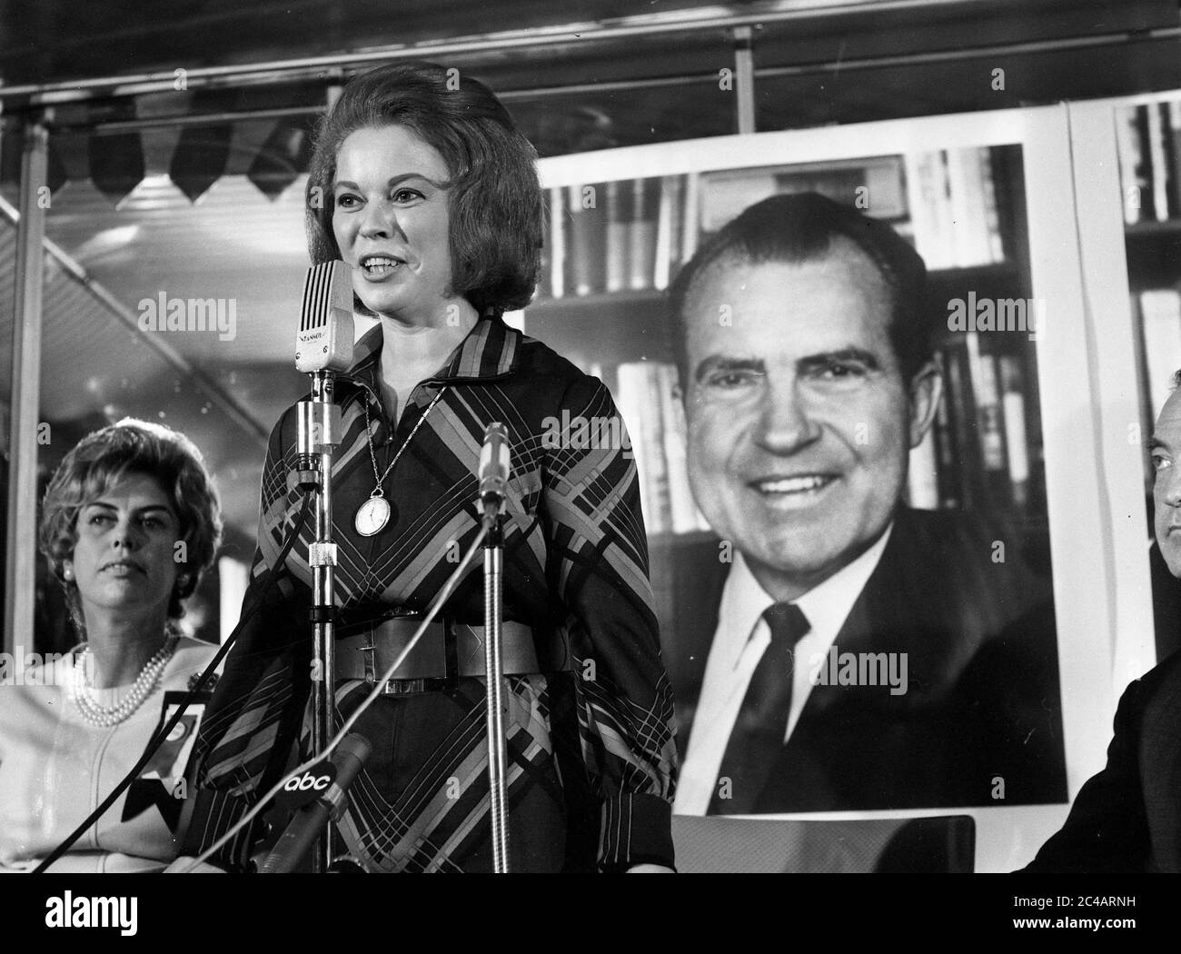 Shirley Temple the former American child actress speaking in front of a poster of Richard Nixon at a Republican Party election press conference at the Cafe Royal in London. 13th September 1968: Stock Photo
