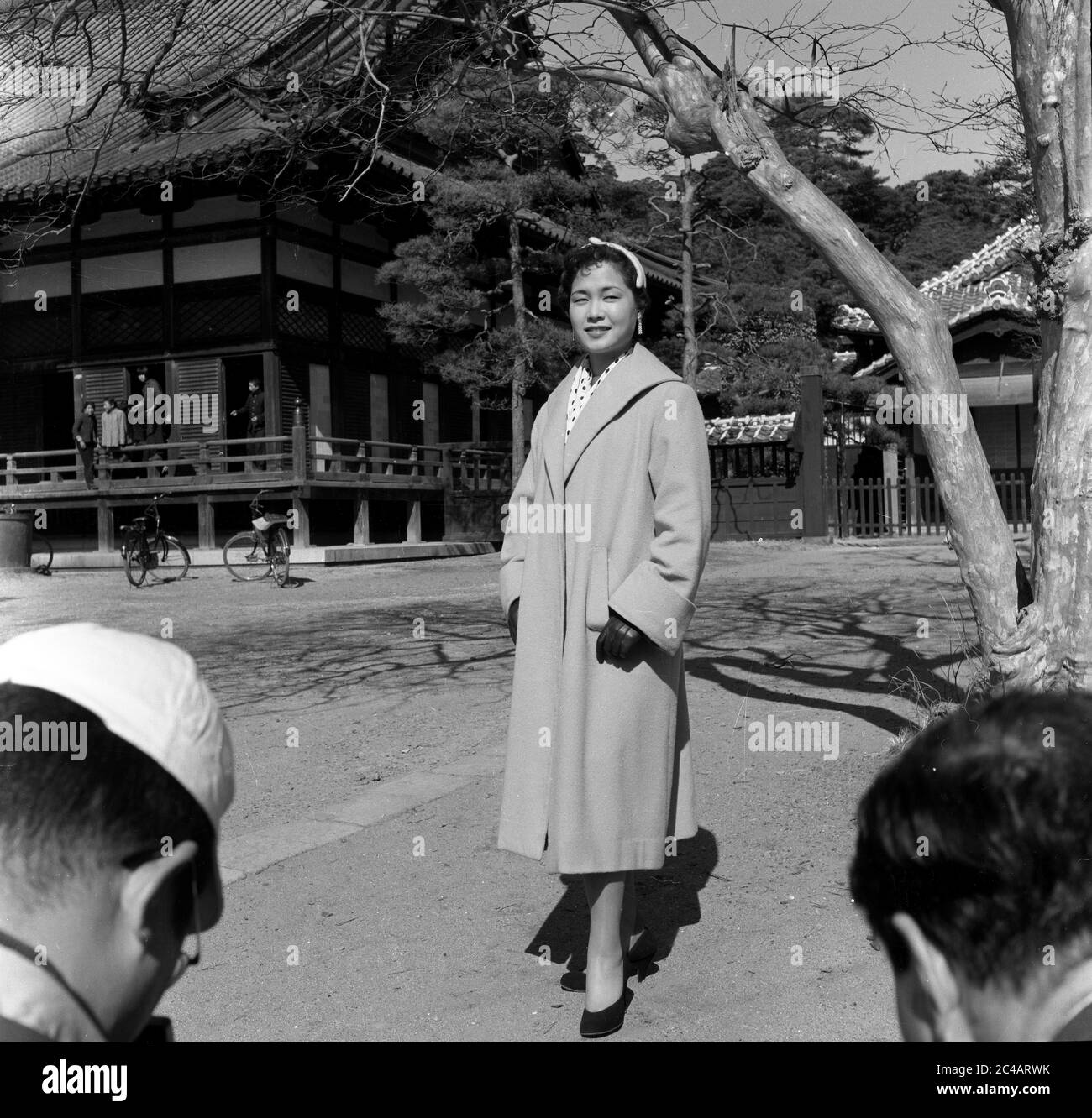 Japanese fashion model woman female posing for photographers 1950's Street Scene, Japan Stock Photo
