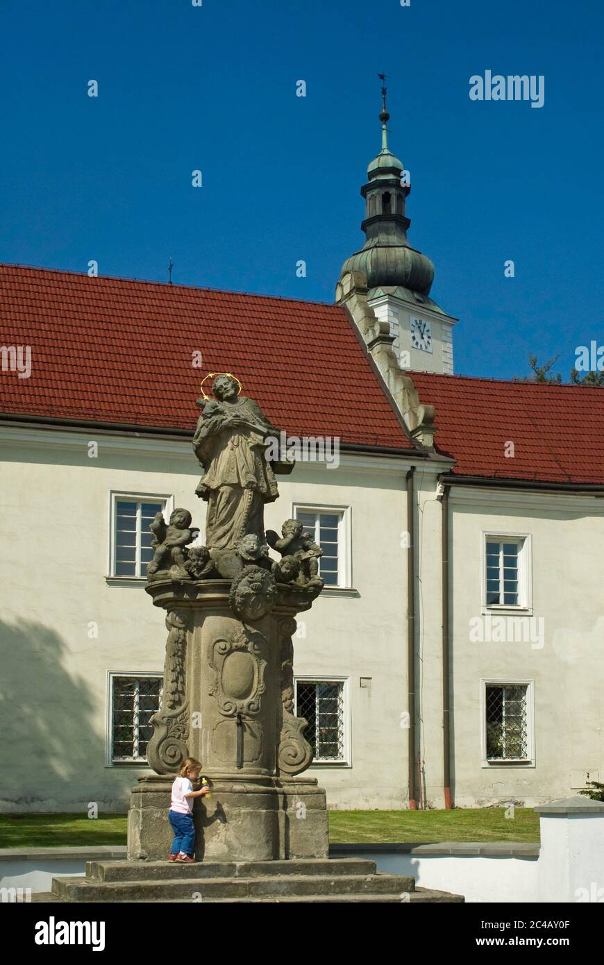 Statue of Saint John of Nepomuk and castle at Zamecke namesti, town square in Frydek part of Frydek-Mistek, Moravian-Silesian Region, Silesia, Czechia Stock Photo