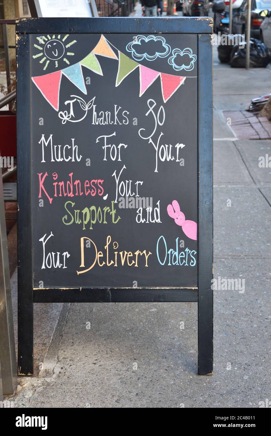 Blackboard sign reading 'Thanks So Much For Your Kindness, Your Support & Your Delivery Orders' in colorful chalk script, April 6, 2020, in New York. Stock Photo