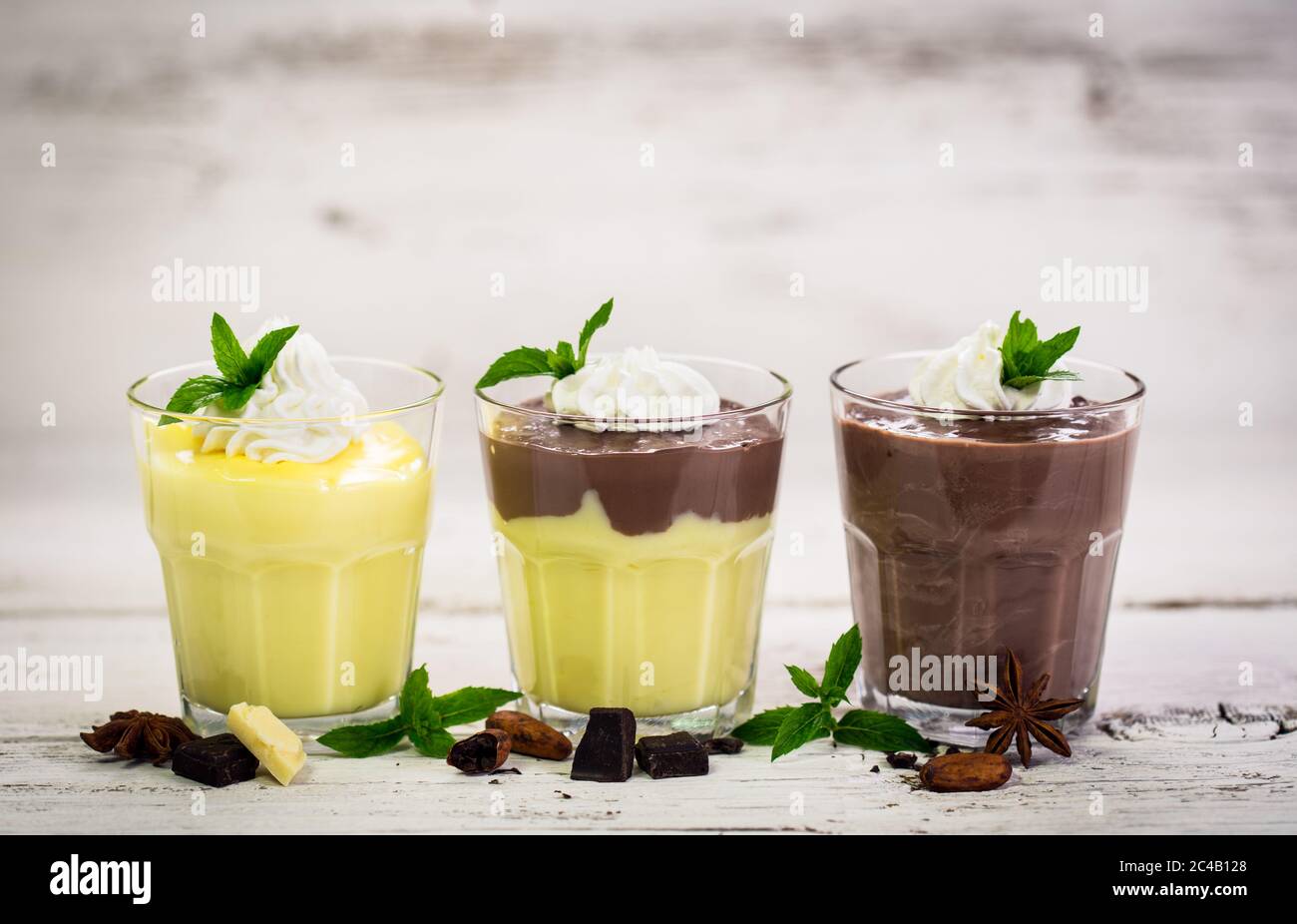 Chocolate and vanilla pudding with whipped cream Stock Photo Alamy
