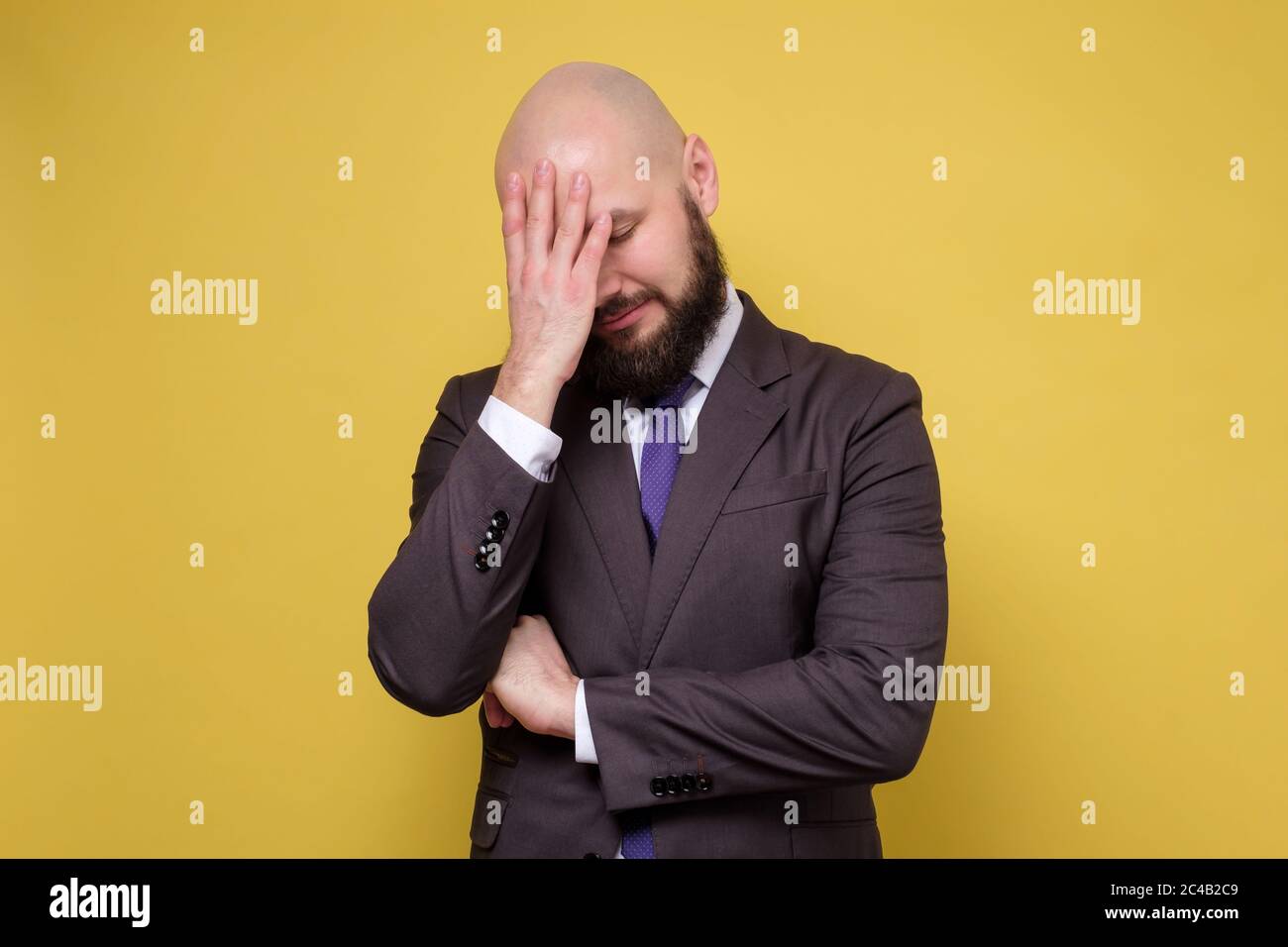 mature man trying to concentrate, or suffering from headache Stock Photo
