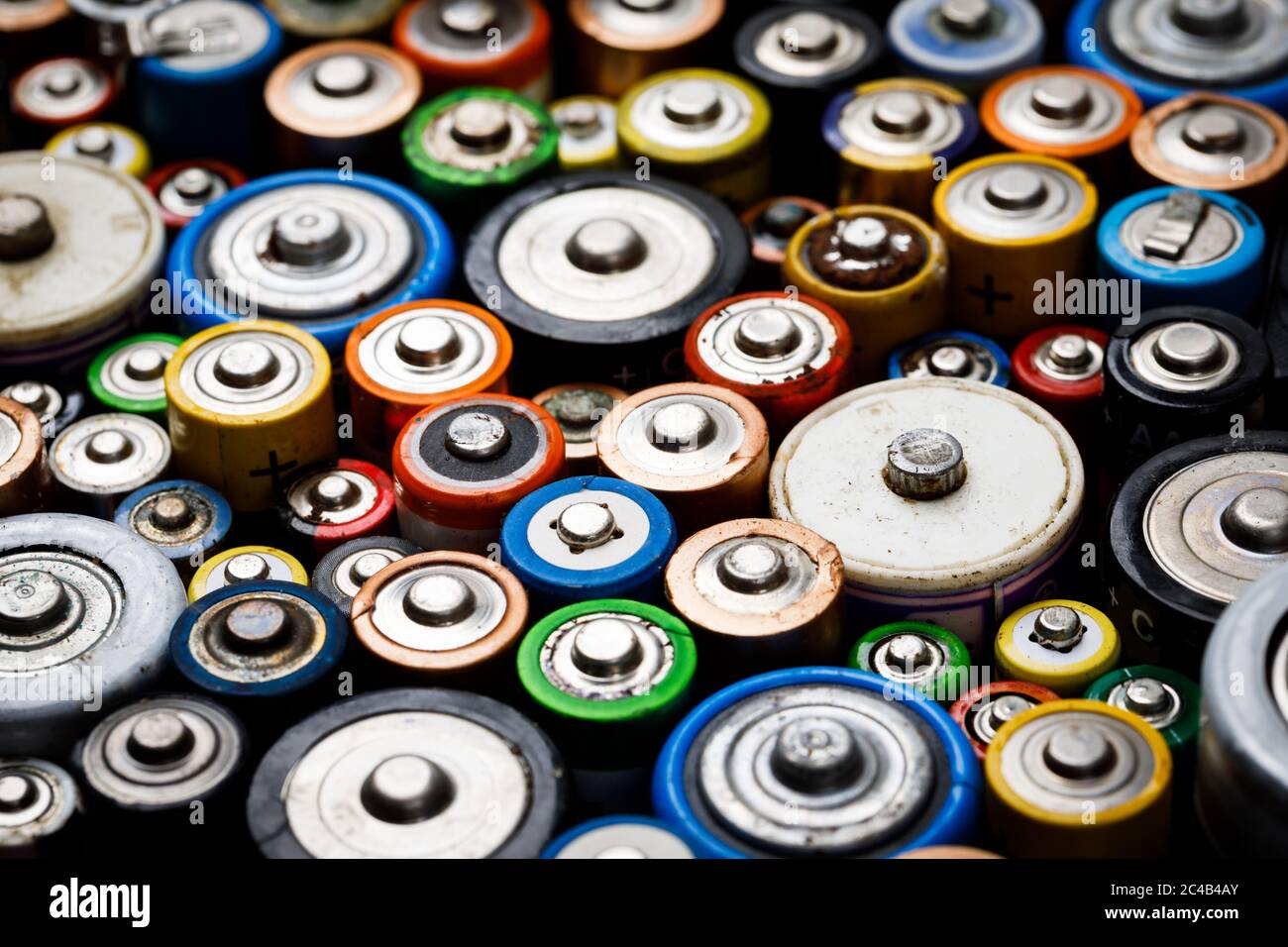 Dumped used batteries of various types (C AA AAA D 9V) collected for recycling toxic waste and