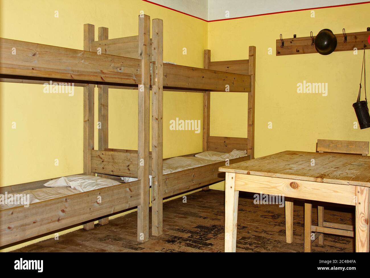 living quarters; German bunker interior; yellow walls, wood bunk beds,  brick floor, plain, Atlantic Wall Open Air Museum; WWI and II defense;  military Stock Photo - Alamy