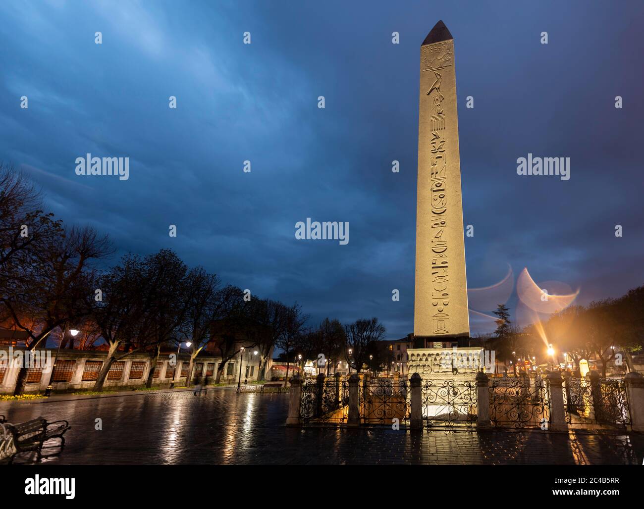 Illuminated Egyptian obelisk on the Hippodrome in the evening, also Sultanahmet Squarean part, Istanbul, Turkey Stock Photo
