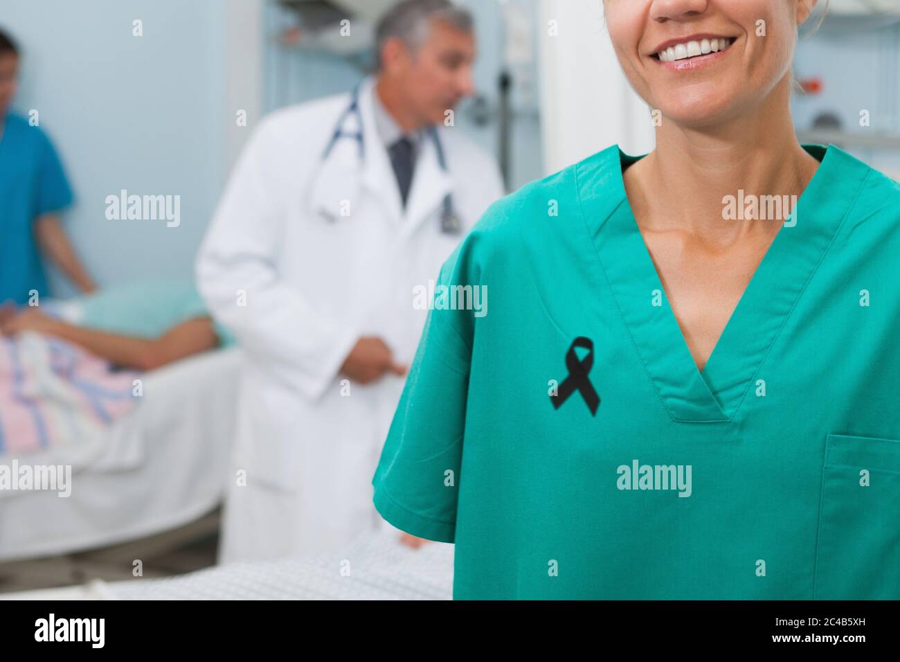 Mid section of lady nurse with black ribbon on robe smiling Stock Photo