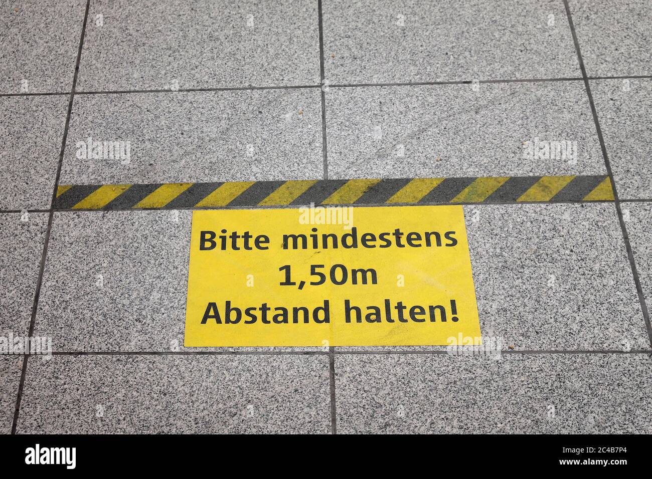 Sticker on the floor, note 1, keep 5m distance, Munich, Bavaria, Germany Stock Photo