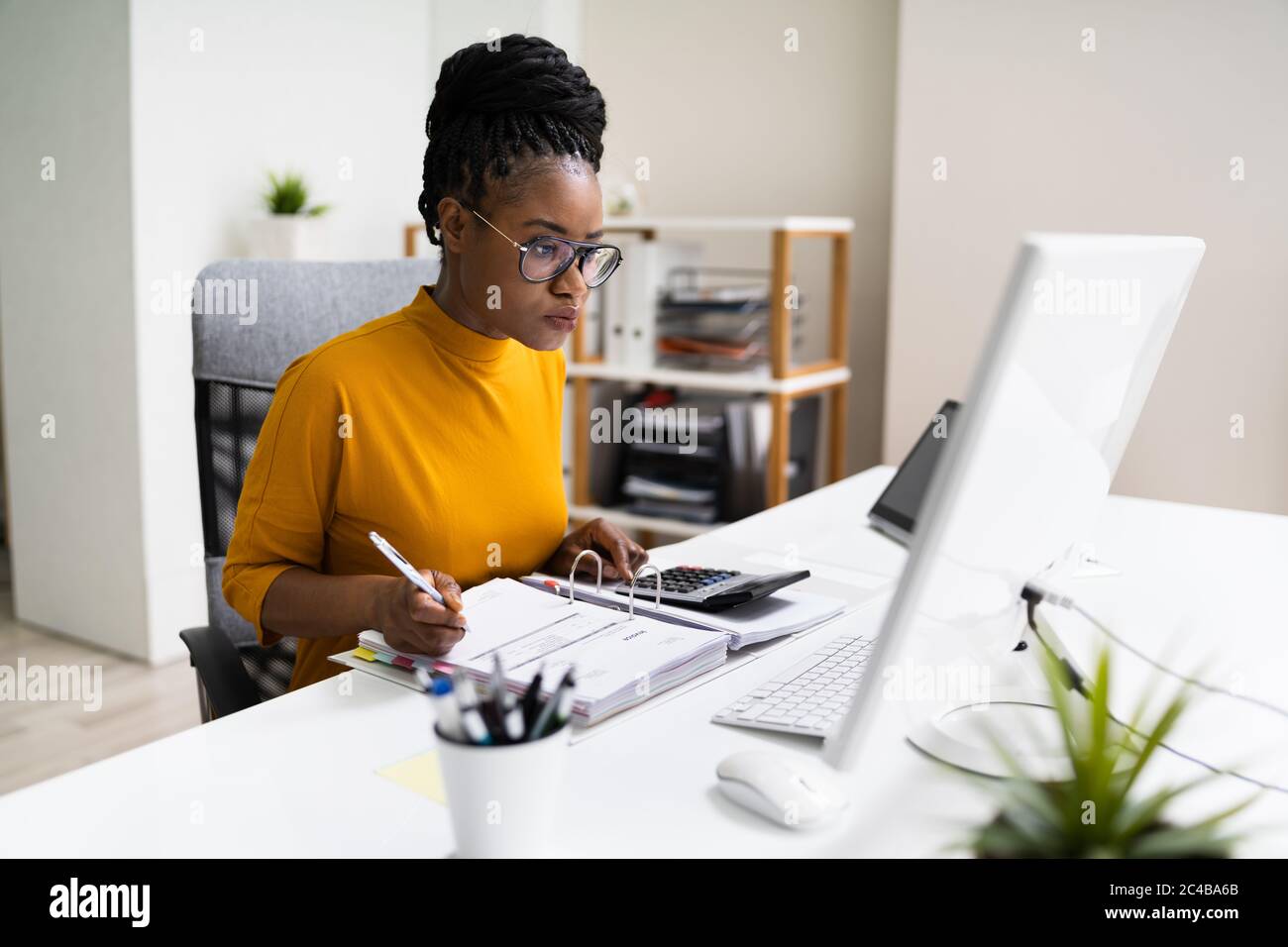 African American Business Accountant In Office Doing Accounting Work Stock Photo Alamy