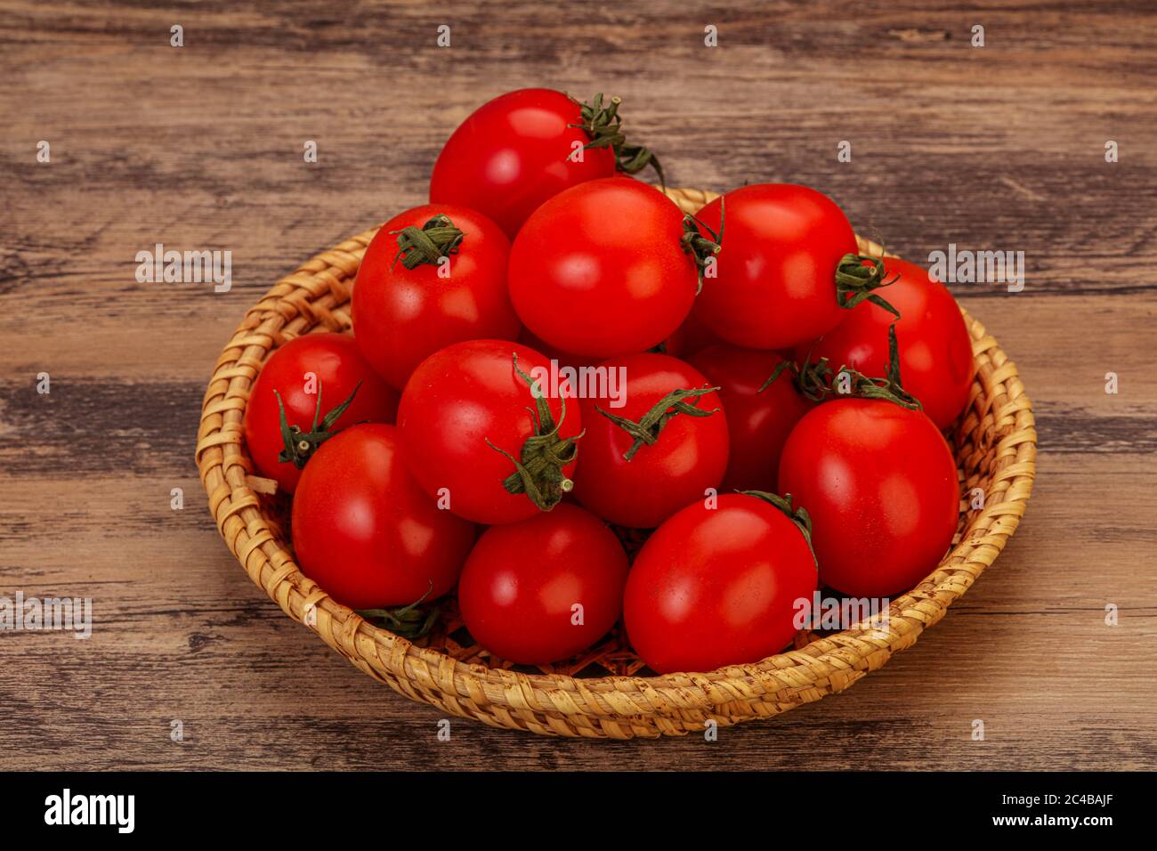 Ripe juicy red cherry tomato in the bowl Stock Photo - Alamy