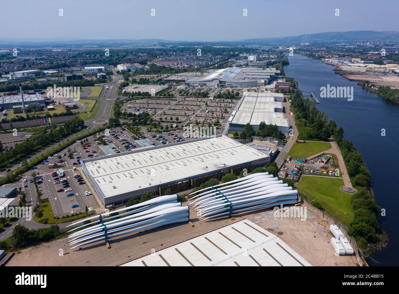 Aerial view of Braehead shopping and retail park next to River Clyde and wind turbine blades at King George V dock in Glasgow, Scotland, Uk Stock Photo