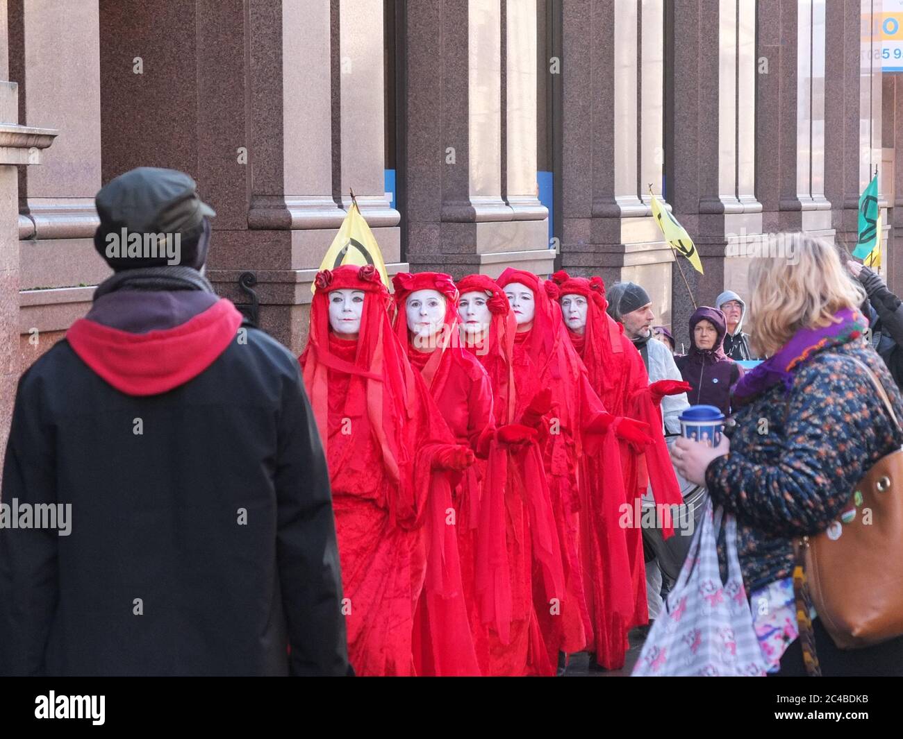Extinction Rebellion Red Brigade protesters processing on the the streets of Nottingham UK in February 2020 Stock Photo