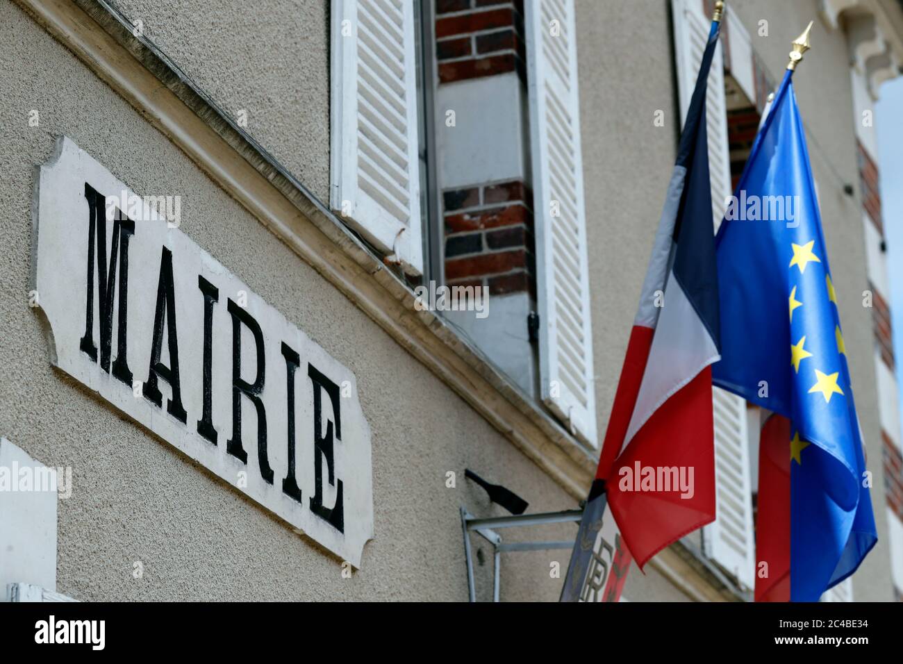 Town hall with french and european flags Stock Photo