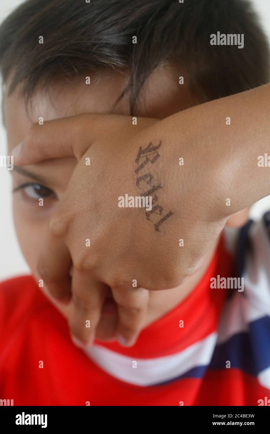 Teenagers with a rebel tatoo in montrouge, france Stock Photo