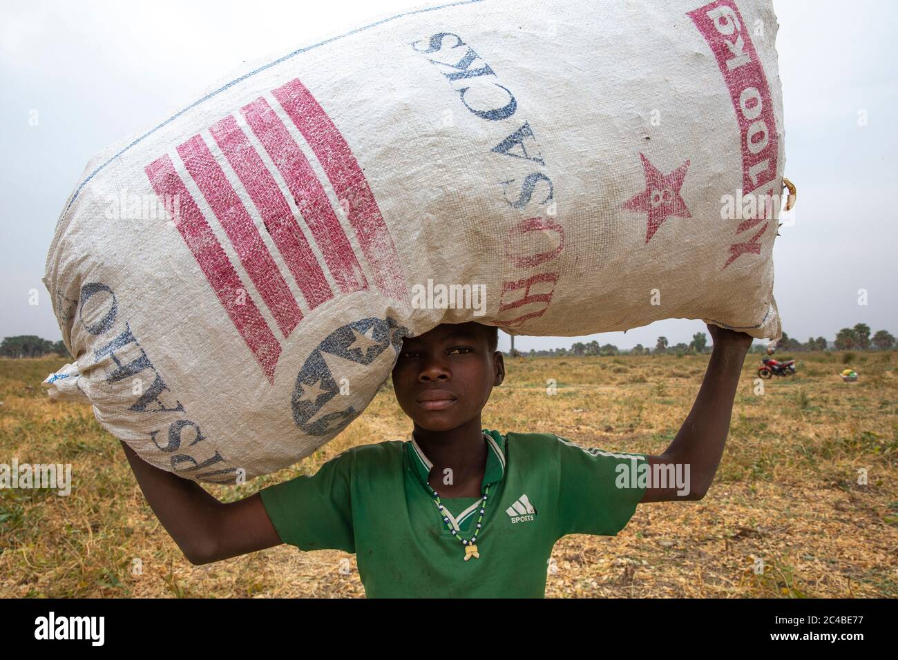 Boy carrying a bag in tambonga, togo Stock Photo