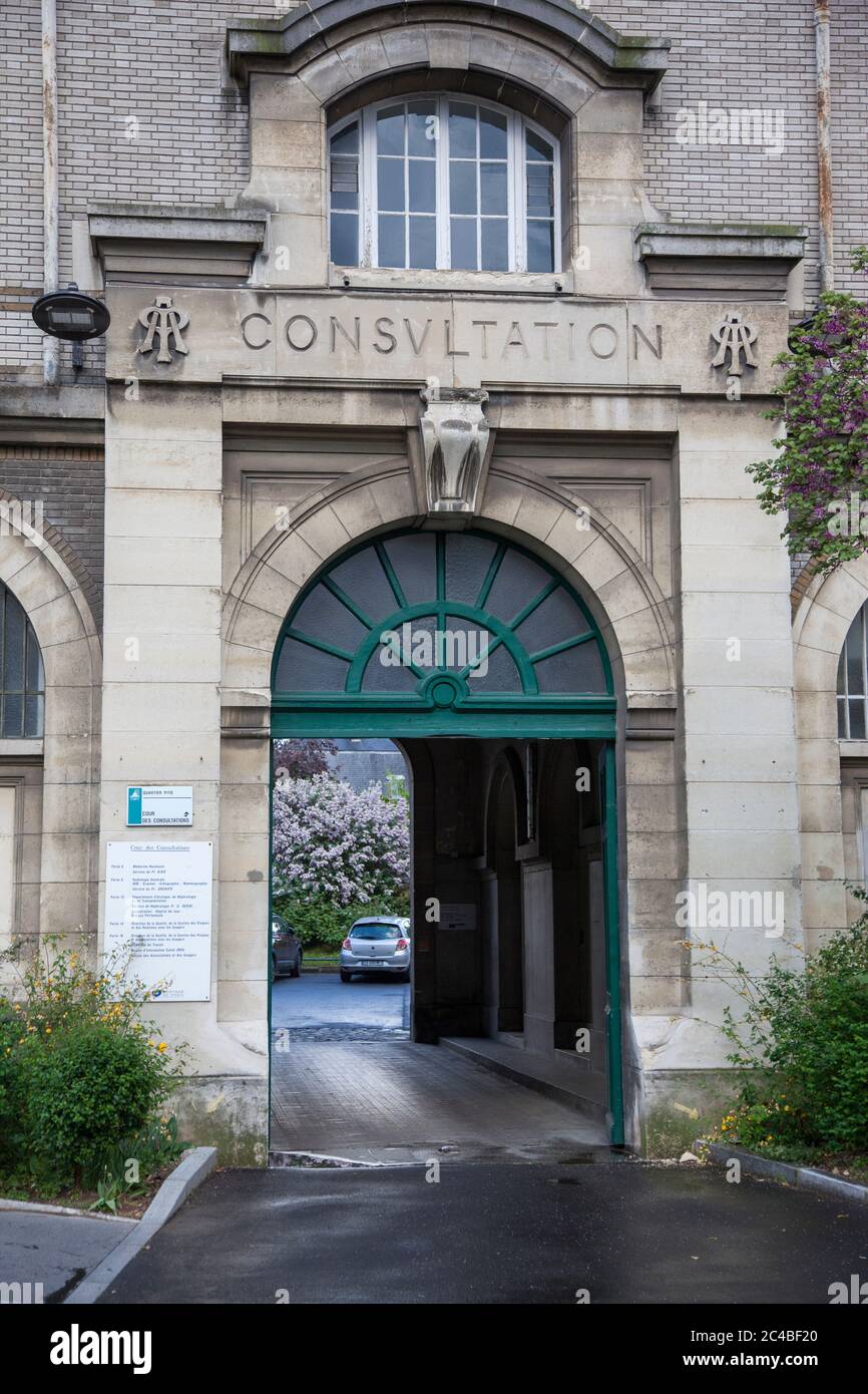 Former entrance to the Consultations at La Pitié-Salpêtrère University Hospital in Paris 75013 during the sanitary crisis linked to the coronavirus in Stock Photo