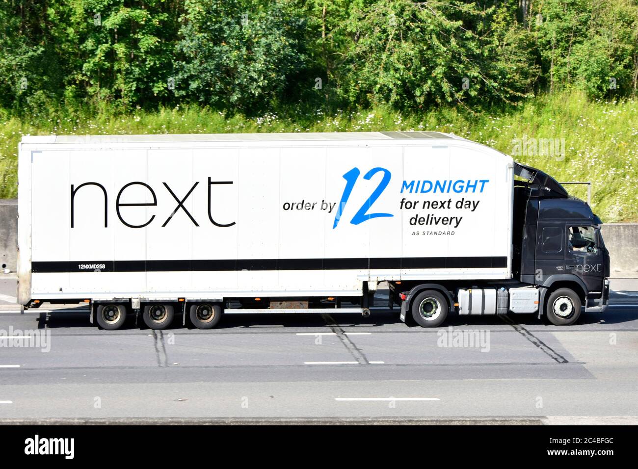 Hgv lorry truck Next retail clothing business supply chain articulated store  shop delivery trailer brand advert for online shopping on UK motorway Stock  Photo - Alamy