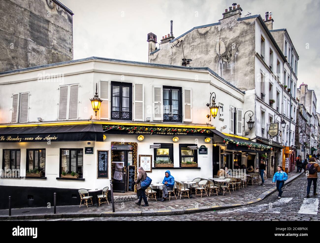 Paris, France, Feb 2020, urban scene  by the bar-restaurant “Le Rendez-Vous Des Amis” in the heart of Montmartre district Stock Photo