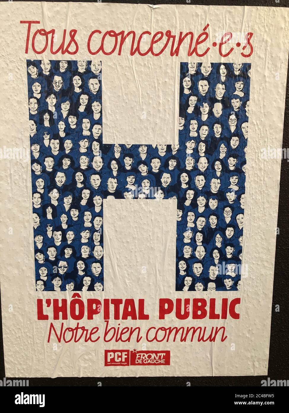 Hospital H on a poster of the PCF (French Communist Party) recalling that the hospital is a public service. Stock Photo