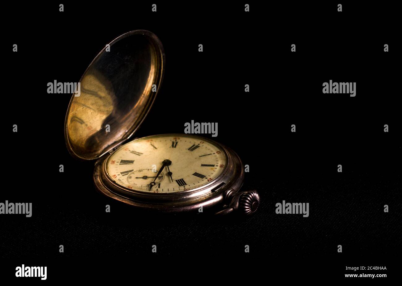 Old Pocket watch with a black background. Close up view Stock Photo Alamy