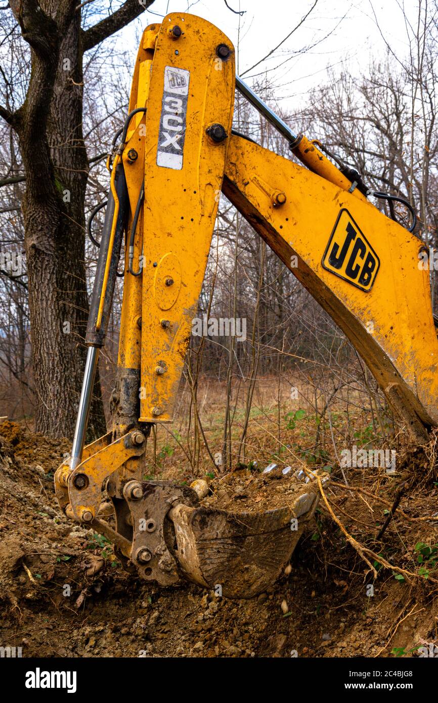 Trostyanets, Ukraine December 20, 2019: excavator digs soil in pond forest.2020 Stock Photo