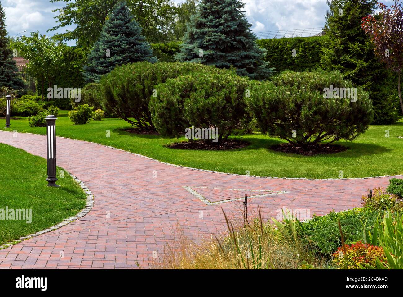 the intersection of footpaths from paving slabs for walks in the park ...