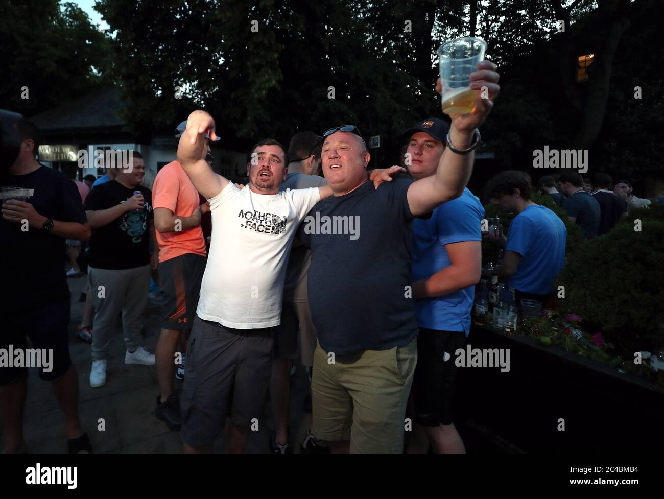 Liverpool fans celebrate outside a pub in Liverpool Stock Photo Alamy