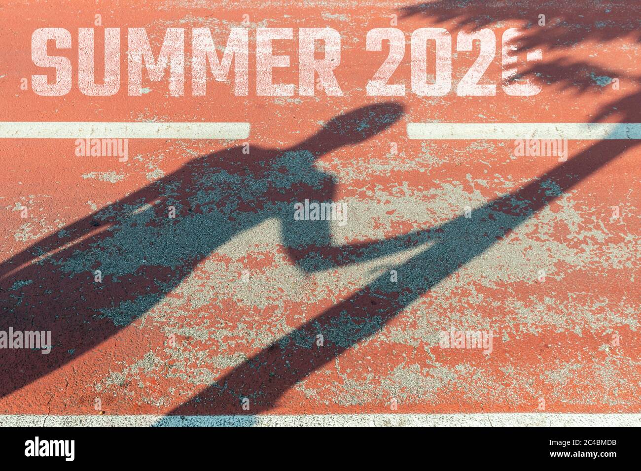 Silhouette woman and tree on asphalt with text summer 2020 concept travel Stock Photo